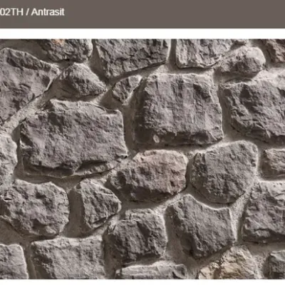 Modern ve güçlü hatlara sahip, koyu antrasit kültür taşı.